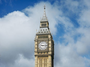 Low angle view of clock tower against sky