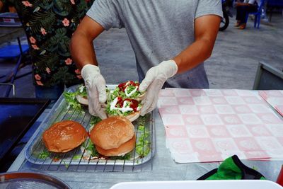High angle view of man preparing food on table