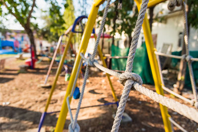 Close-up of swing in playground