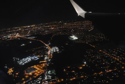 Aerial view of illuminated cityscape at night