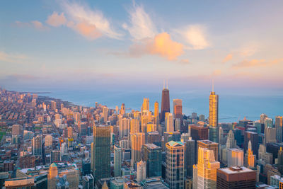 Aerial view of city buildings during sunset