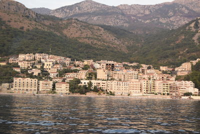 Buildings in town with mountain range in background