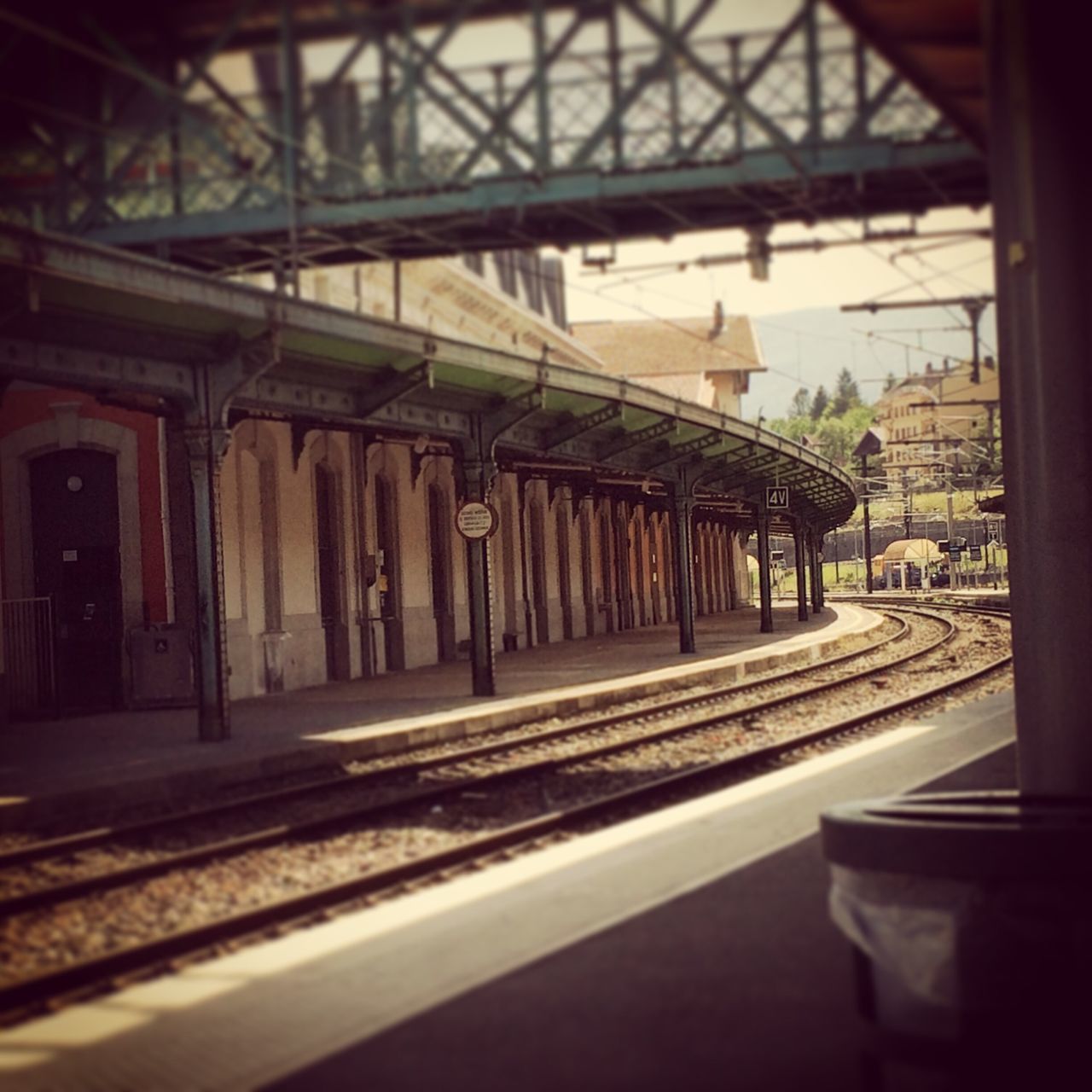 architecture, built structure, transportation, railroad track, indoors, building exterior, architectural column, railroad station, rail transportation, the way forward, railroad station platform, no people, public transportation, empty, railing, diminishing perspective, day, sky, road, city