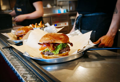 Close-up of food on table with people in background at restaurant