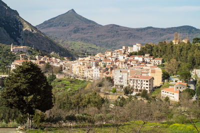 Buildings in town against sky