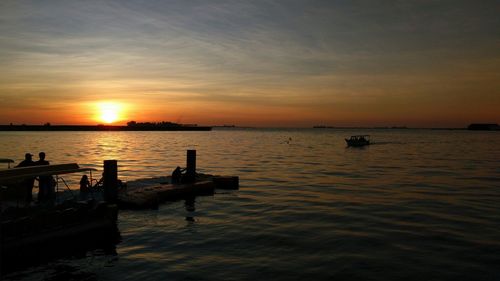Scenic view of sea at sunset