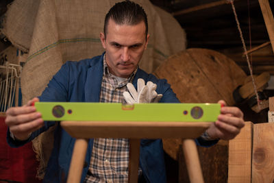 Man working on wooden table