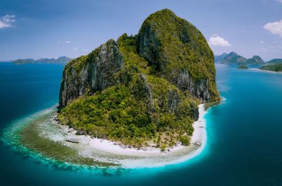 Aerial view of sea and mountain against sky