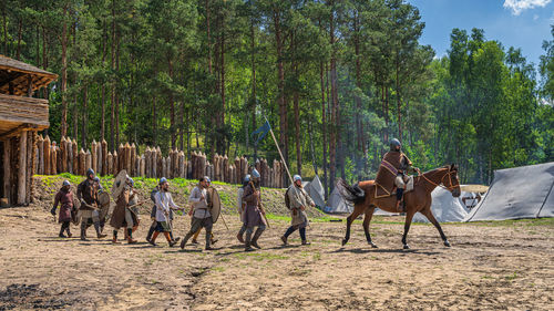 Group of people against trees