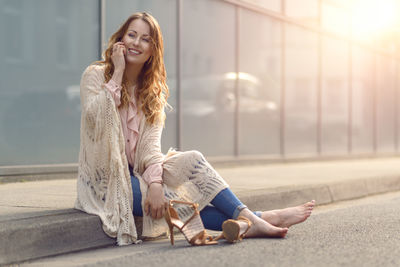 Young woman using mobile phone outdoors