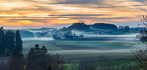 Scenic view of landscape against sky during sunset