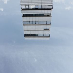 Low angle view of skyscraper against sky