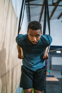 Male athlete exercising in gym