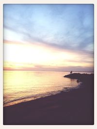 Scenic view of sea at sunset