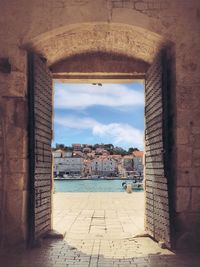 View of town seen through open door