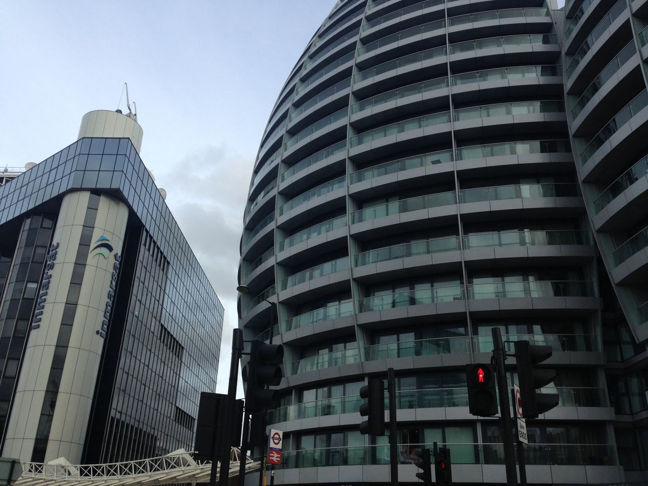 LOW ANGLE VIEW OF OFFICE BUILDINGS AGAINST SKY