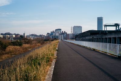 Road in city against sky