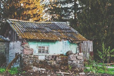 Exterior of old house in forest