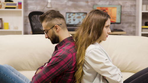 Side view of young woman looking away