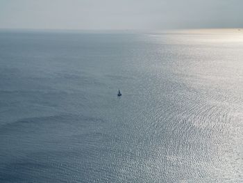 Scenic view of a lone sailboat in the sea of marmara and the horizon 