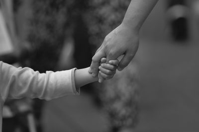 Close-up of hands against blurred background