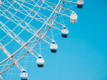 Low angle view of communications tower against clear blue sky