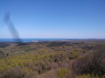 Scenic view of landscape against clear blue sky