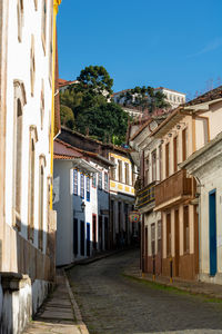 Street amidst buildings against sky