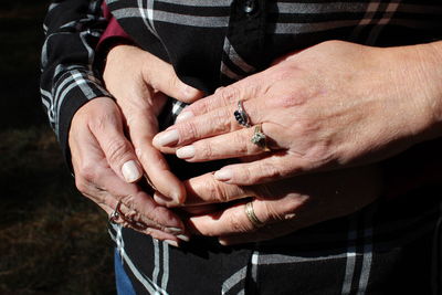 Close-up of man holding hands