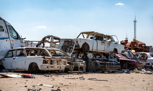 Abandoned vehicle on beach against clear sky