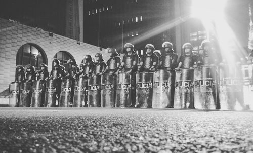 Low angle view of police standing on street