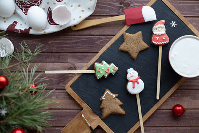 Flat lay with traditional christmas gingerbread. process of homemade decoration. new year holidays