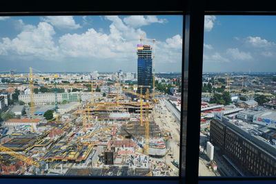 High angle view of buildings in city against sky