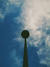 Low angle view of street light against cloudy sky