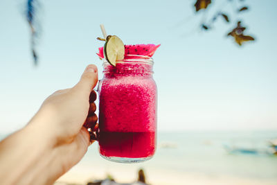 Midsection of woman holding drink