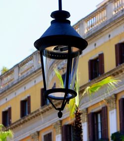 Low angle view of lamp against sky