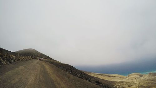 Road amidst landscape against clear sky