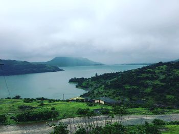 Scenic view of sea against cloudy sky