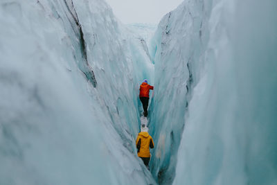 Panoramic view of people on snowcapped mountain