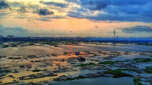 Scenic view of sea against cloudy sky