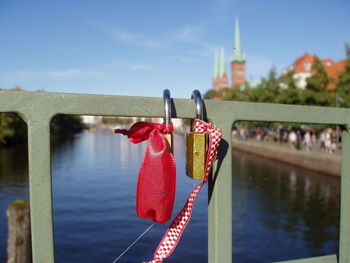 Padlocks on bridge over river