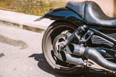 Close-up of motorcycle on street