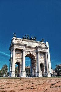 Low angle view of historical building against blue sky