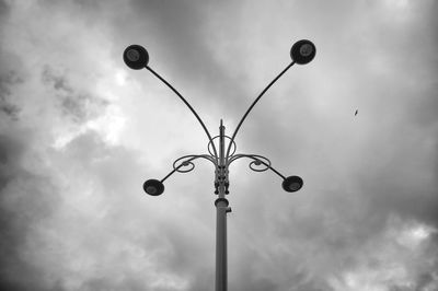 Low angle view of street light against sky