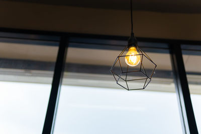 Low angle view of illuminated pendant light