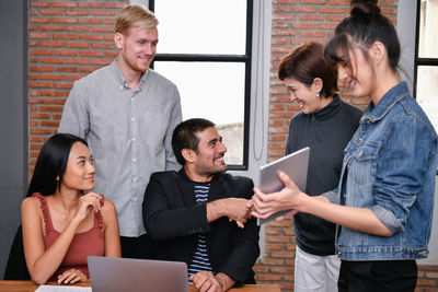 Business people discussing at desk in office