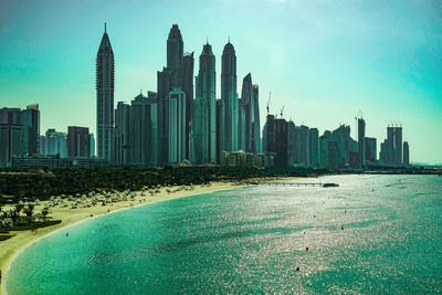 Modern buildings in city against sky