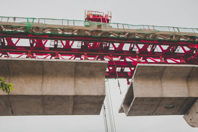 Low angle view of railway bridge against sky