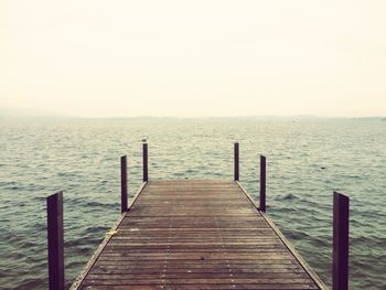 Pier against sea and clear sky