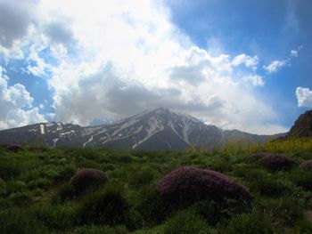 Scenic view of mount damavand against cloudy sky